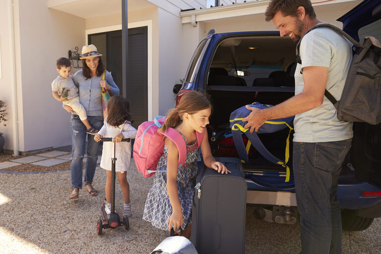 Family Packing Car Ready For Summer Holiday | Tasman Holiday Parks