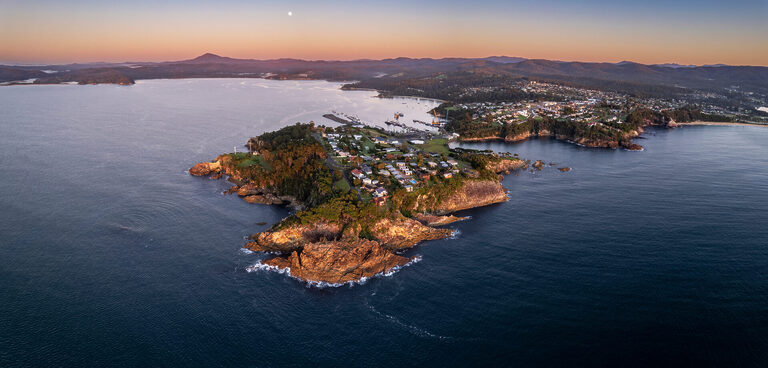 Dawn aerial panorama of the coastal town of Eden, NSW Australia | Tasman Holiday Parks Merimbula