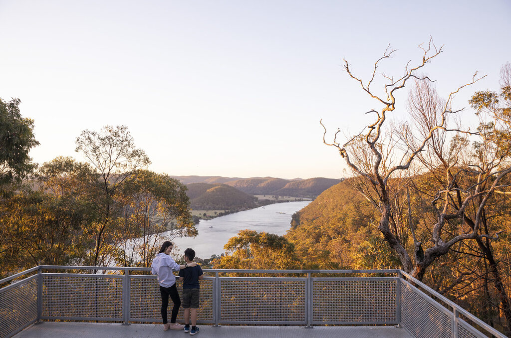 Mother and son enjoying scenic views across the Hawkesbury River from Hawkins Lookout, Wisemans Ferry.