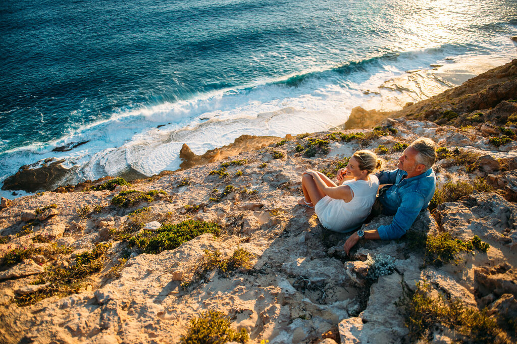 Couple watching sunset in Dirk Hartog Island National Park.