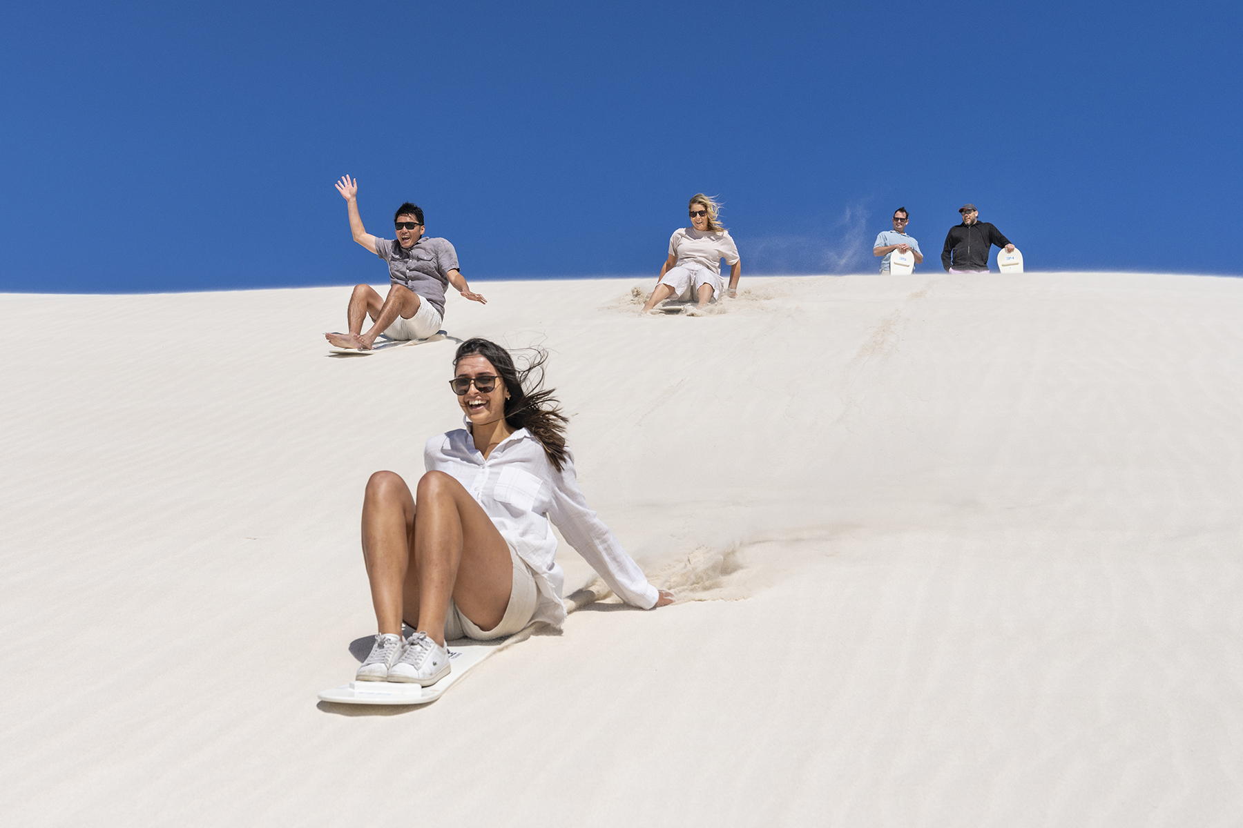 People Sandboarding | Tasman Holiday Parks - Ledge Point