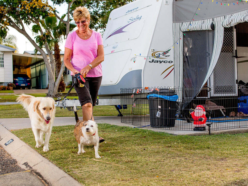Lady walking her dog | Tasman Holiday Parks - Hervey Bay