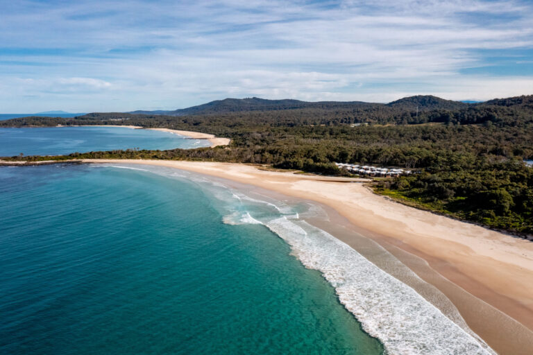 Aerial photograph of coastline at Racecourse Beach | Tasman Holiday Parks