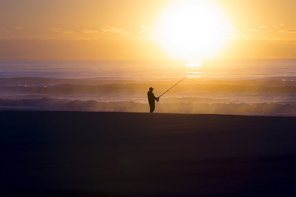 Man Fishing at Torquay Beach
