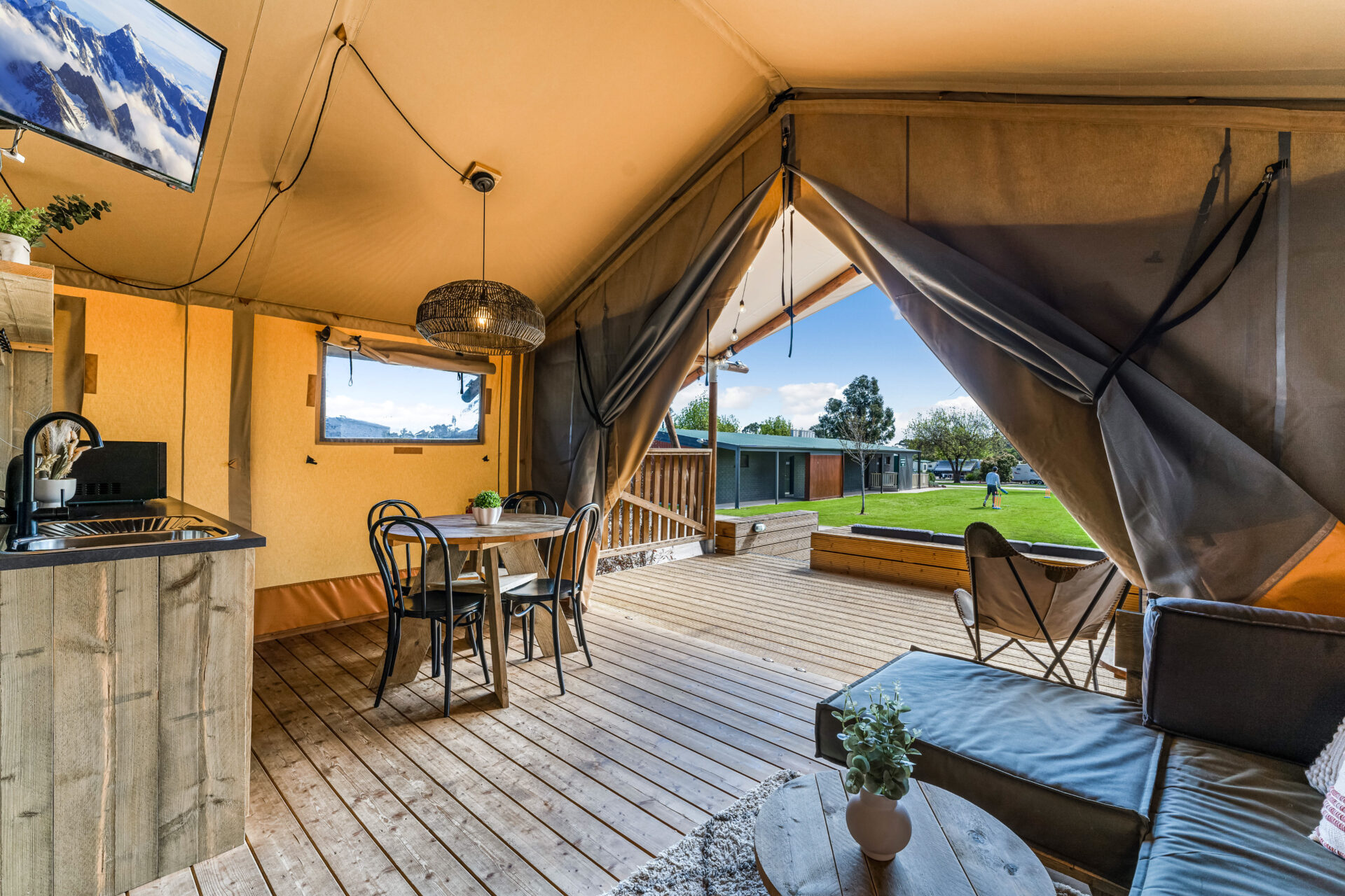 Glamping tent dining and living space | Tasman Holiday Parks Bendigo