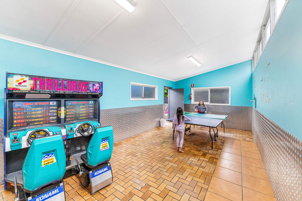 Games room with table tennis and arcade games | Tasman Holiday Parks Geelong