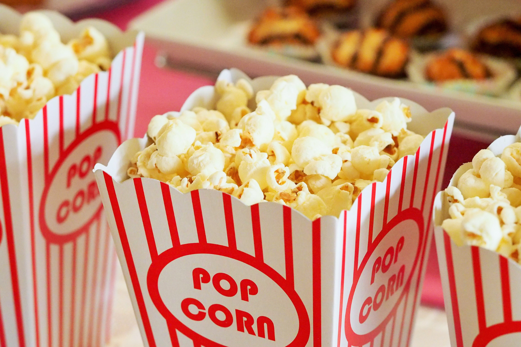 A close up of popcorn in a container.