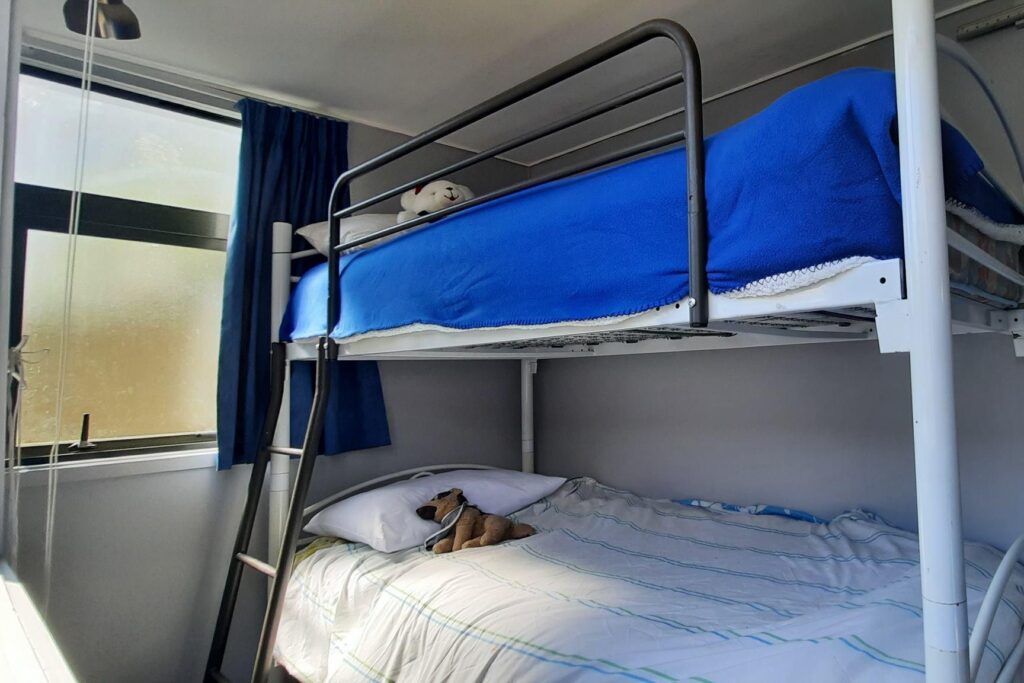 Cabin #145 bedroom 2 featuring bunk beds
