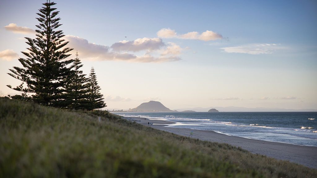 View of The Mount from Papamoa Beach at sunset. One of the Top Things to do in Papamoa