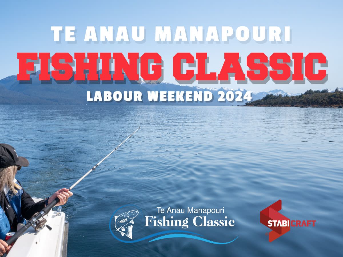 A person in a boat is fishing on a lake with mountains and clear sky in the background. The text on the image reads "Te Anau Manapouri Fishing Classic Labour Weekend 2024" along with logos for the event and Stabicraft.